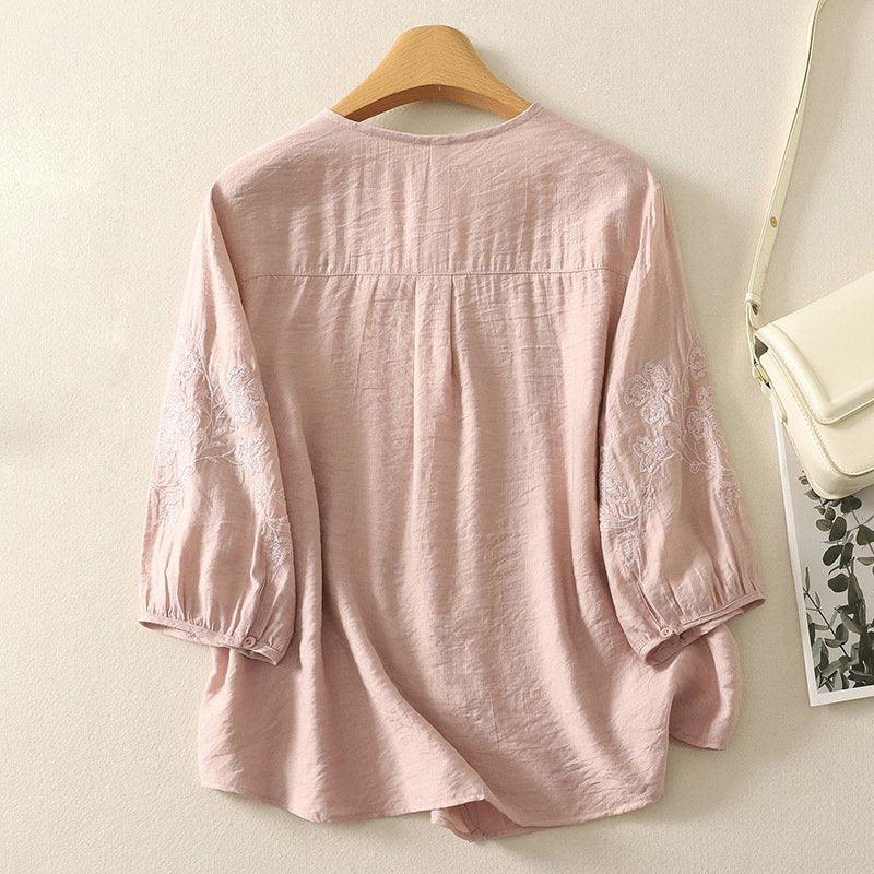 Bianca Linen Blouse back view — embroidered floral sleeve detail